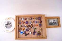 A large quantity of Butlins badges and other related items