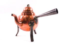 An Arts & Crafts copper and steel teapot with side handle,