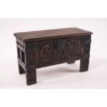 A doll's house oak coffer in the 17th century style,