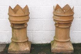 A pair of Victorian crown top chimney pots,