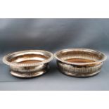 A pair of silver plated sauce boats with double "C" scroll handles and shell and hoof feet,