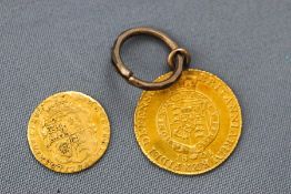 A yellow gold 1801 George III half guinea coin with soldered ring and jump ring, 5.