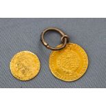 A yellow gold 1801 George III half guinea coin with soldered ring and jump ring, 5.