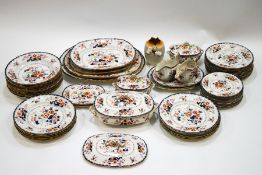 A 19th century Masons ironstone dinner service, decorated with flowers and some Oriental motifs,