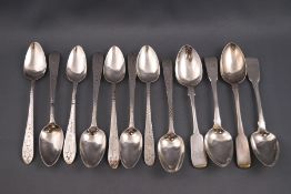 A set of eight Irish silver tea spoons, each with bright cut decoration and engeraved with "HE" "W",
