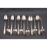 A set of eight Irish silver tea spoons, each with bright cut decoration and engeraved with "HE" "W",