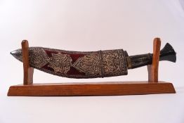 A presentation kukri, given to Major S D Clarke, engraved blade and horn handle,
