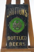 A Bruttons Bottled Beers sign with gilt lettering, 61.