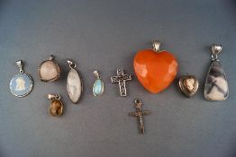 A selection of ten silver pendants of variable designs and gemstones. Gross weight: 74.