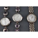 A selection of three silver dress watches to include two with purple gem set bracelets and one with