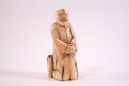 An early 20th century carved ivory okimono,