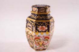 A Royal Crown Derby six sided jar and cover, Witches pattern 6299,