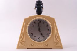 A 1930s Ingersoll cream bakelite lamp/clock,