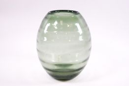 A Stevens & Williams green glass vase of beehive design,