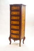 A Louis XV style rosewood and burrwood tall chest of seven drawers with gilt metal mounts,