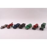 Seven 1940's/50's Dinky die-cast vehicles: two Austins trucks, pick up truck, two petrol carriers,