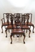 A set of six George III style mahogany dining chairs, including one carver,