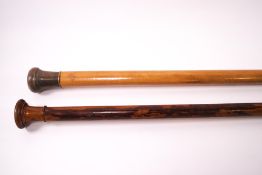 A pair of walking canes, one malacca with turned knop,