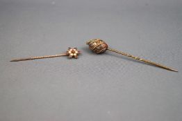 Two boxed hat pins consisting of a yellow gold garnet and pearl flower cluster and an abstract