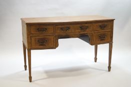 An Edwardian mahogany bow fronted sideboard with five drawers,