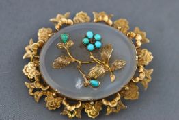 A Victorian gold and chalcedony oval brooch,