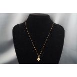 An 18ct gold, sapphire and diamond square cluster pendant, post 2000 Edinburgh convention hallmarks,