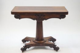 A William IV rosewood card table on tapering cylindrical pedestal on wasted rectangular base with