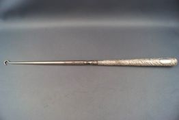 A large Victorian silver handled button hook,