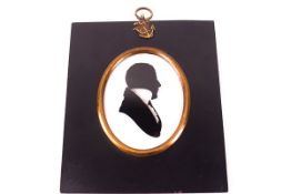 A 19th century silhouette of a Gentleman, possibly a Naval officer,