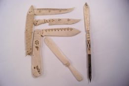 Two carved and pierced bone folding knives, one as a fish, the other as two birds,