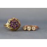 Two gold rings comprising; a German yellow metal and amethyst seven stone cluster ring,
