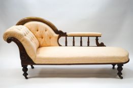 A Victorian mahogany button back chaise longue with spindle back and scroll frame on turned legs,