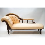 A Victorian mahogany button back chaise longue with spindle back and scroll frame on turned legs,