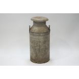 A galvanised ten gallon milk churn,