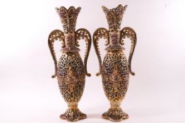 A pair of Fischer Budapest earthenware two handled vases of reticulated form,