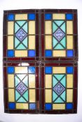 A set of four Victorian stained glass panels, 25cm high x 17.