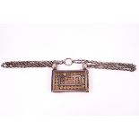 An Oman white metal Koran holder with geometric pattern in relief, on a chain, 7.3cm x 5.5.