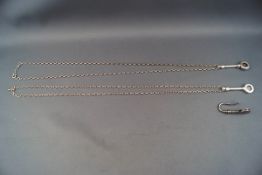 A pair of modern silver serviette clips on silver belcher chains, Birmingham 2004, 31.