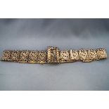 An Eastern white metal panel belt,