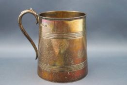 A silver half-pint mug,