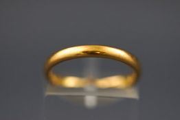 A 22 carat gold wedding ring. Hallmarked 22ct gold, Birmingham, 1935. Size: K 3.