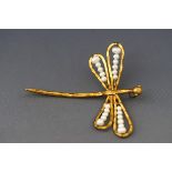 A gilt metal and cultured-freshwater pearl pendant in the form of a dragonfly, approx.