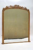 A Victorian over mantel mirror with grape and leaf crest, later gold painted frame,