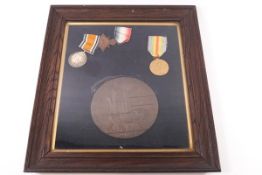 A WWI death penny and three medals (Victory, George V and 1914-15 Star) named to George Attwood,