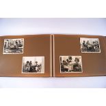 A pair of brown albums containing approximately 161, 9 x 7 and smaller snap shots.