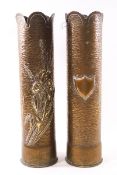 A pair of Trench out shell case vases each with a jacant shield and an iris on a textured ground,