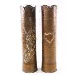 A pair of Trench out shell case vases each with a jacant shield and an iris on a textured ground,