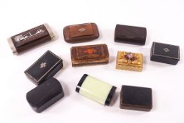 A collection of nine 19th and 20th century snuff boxes, including wooden examples,