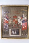 An embroidered 'Souvenir of The Great National War' with inset family photograph, framed,