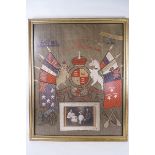 An embroidered 'Souvenir of The Great National War' with inset family photograph, framed,